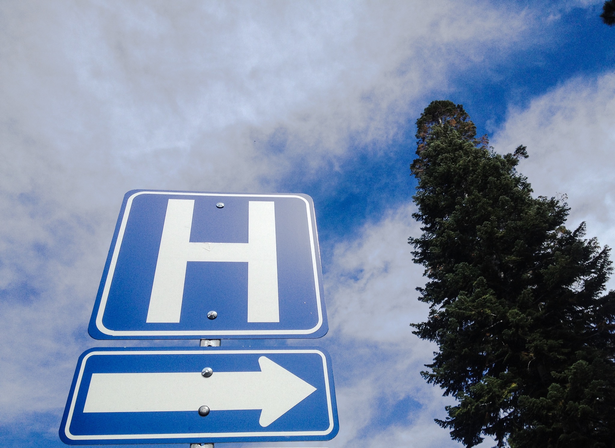 Low Angle View Of Arrow To The Hospital