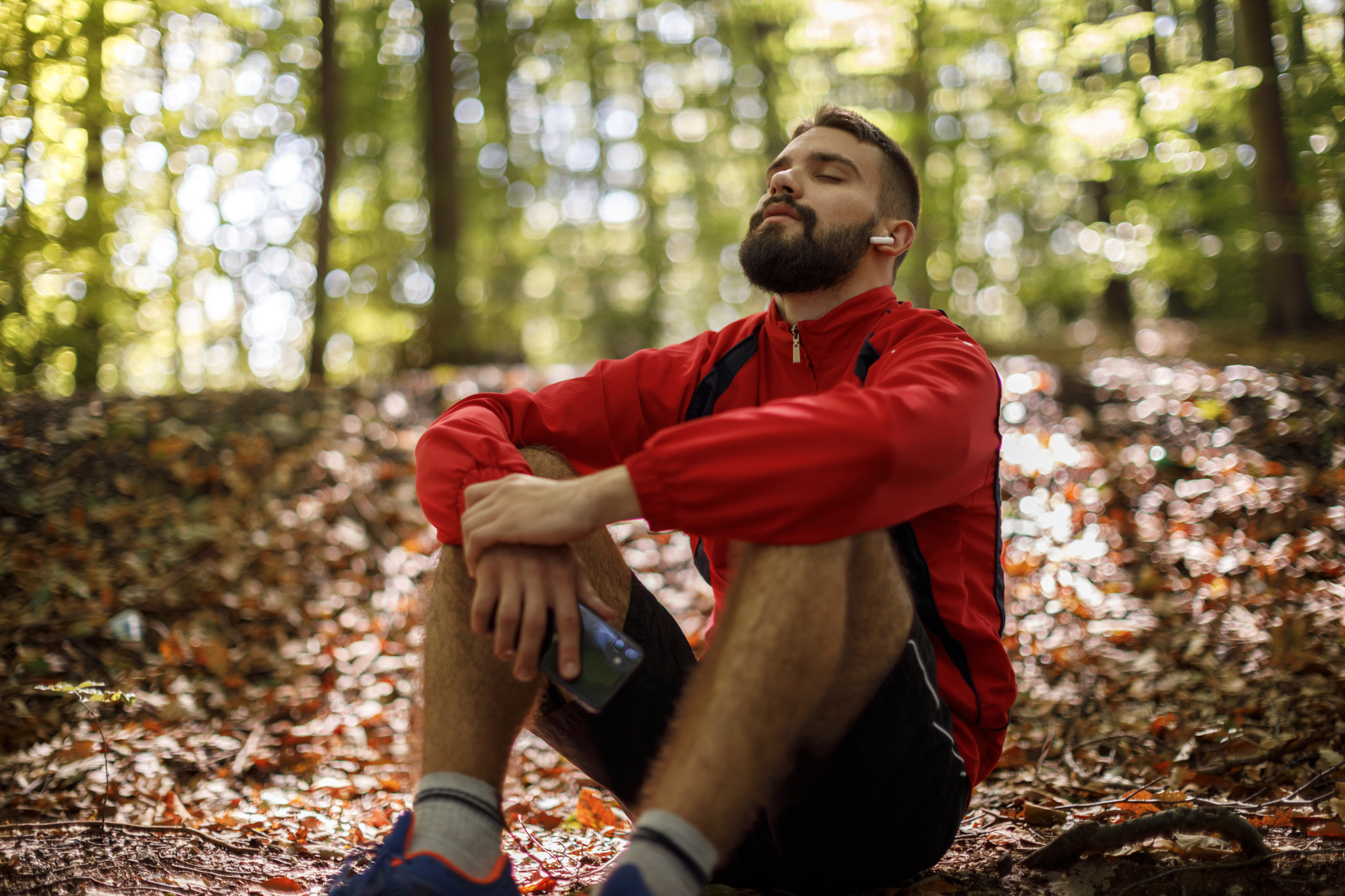 Portrait of relaxed young man with bluetooth headphones in forest Computer Keyboard With Red Cookies Key