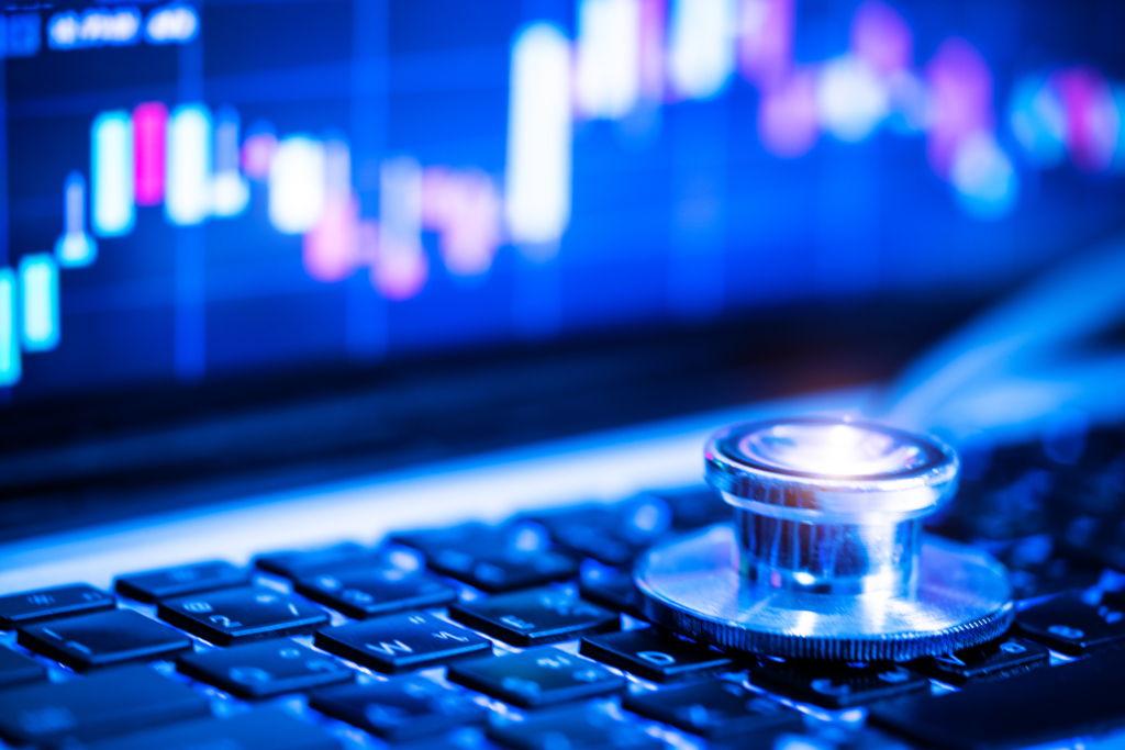 Stethoscope on laptop keyboard.,investment concept