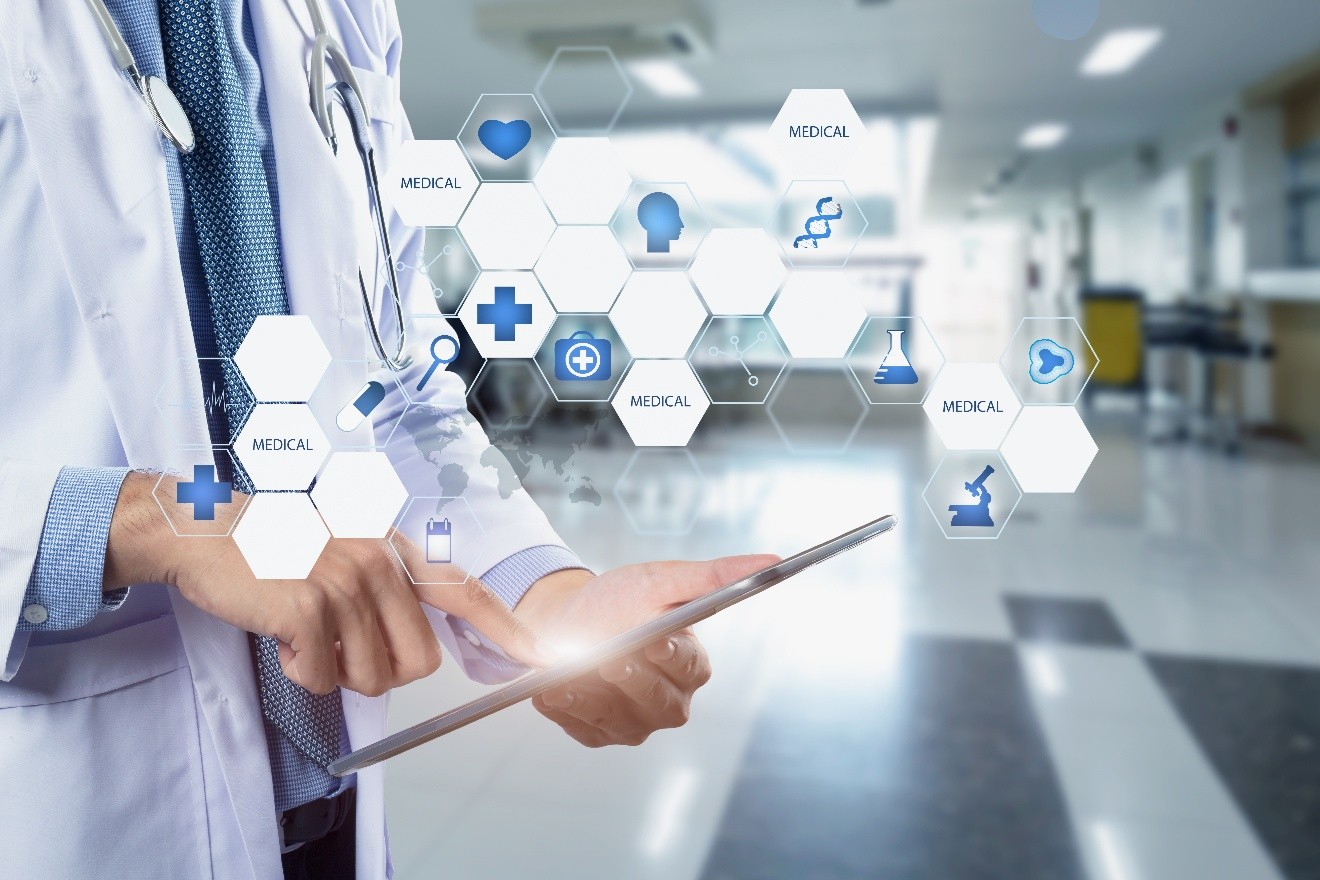 Healthcare provider with tablet exploring social platforms.