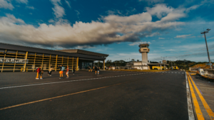 How Drive Time, Schedules, and Connectivity Shape Airport Choice small airport runway with a handful of people outside taking pictures
