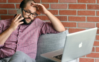 person looking confused using a computer
